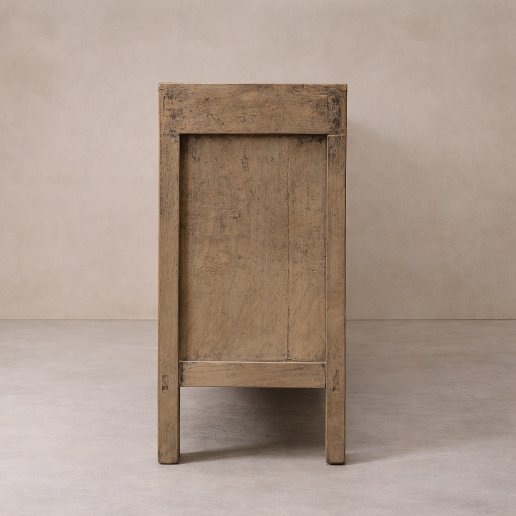 Side angle of the Bruna Weathered Sideboard highlighting its rustic wood finish and simple design.