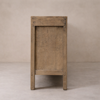 Side angle of the Bruna Weathered Sideboard highlighting its rustic wood finish and simple design.