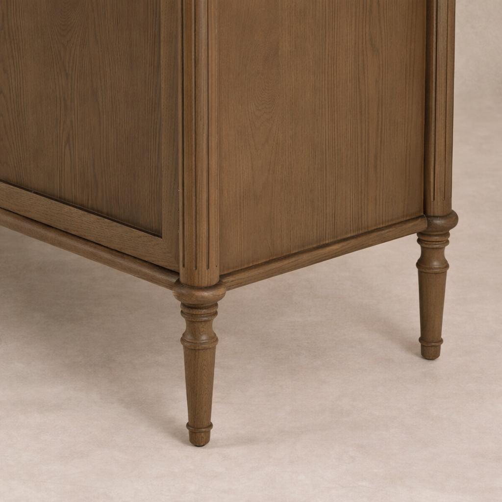 Detail of the Yara Sideboard showcasing its elegant wooden finish and stylish turned legs.