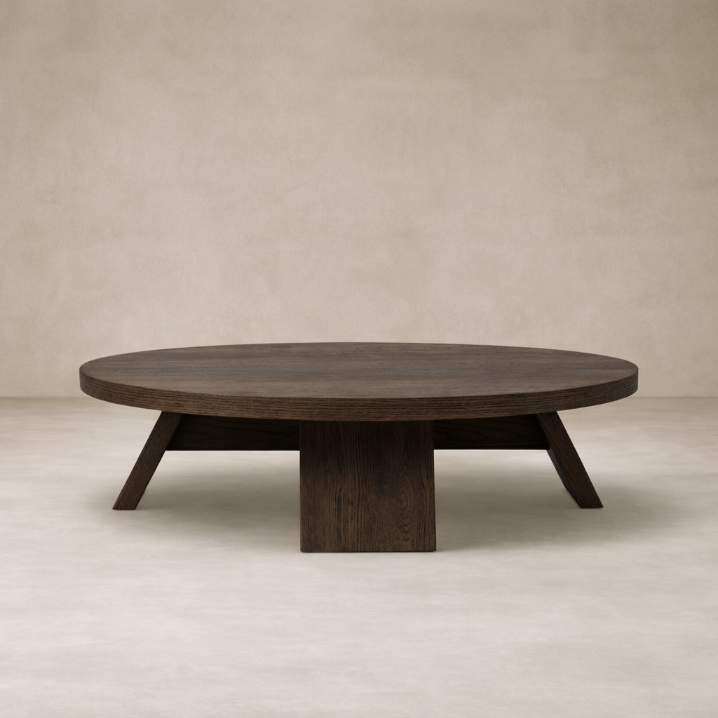 Front view of the Juniper Coffee Table showcasing its round shape and rich dark wood finish.