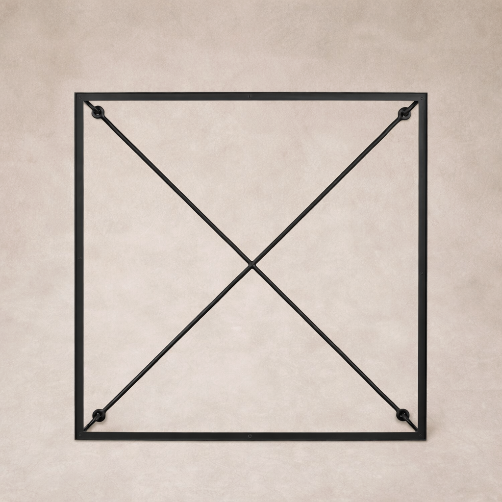 Detail of the Selene Coffee Table's sleek black metal frame with cross-bracing for added stability.