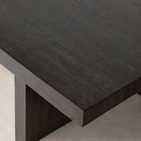 Detail of the Arles Coffee Table highlighting its rich, dark wood grain and minimalist design.
