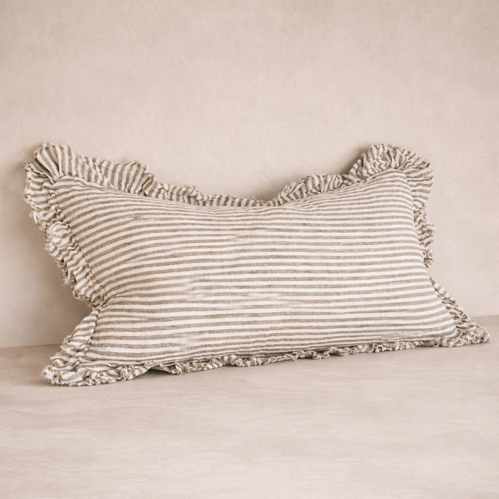 Detail of the Hallie Ruffled Linen Pillow in Olive Stripes, showcasing its textured ruffle edges and soft fabric.