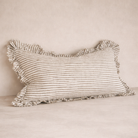 Detail of the Hallie Ruffled Linen Pillow in Olive Stripes, showcasing its textured ruffle edges and soft fabric.