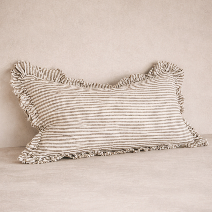 Detail of the Hallie Ruffled Linen Pillow in Olive Stripes, showcasing its textured ruffle edges and soft fabric.