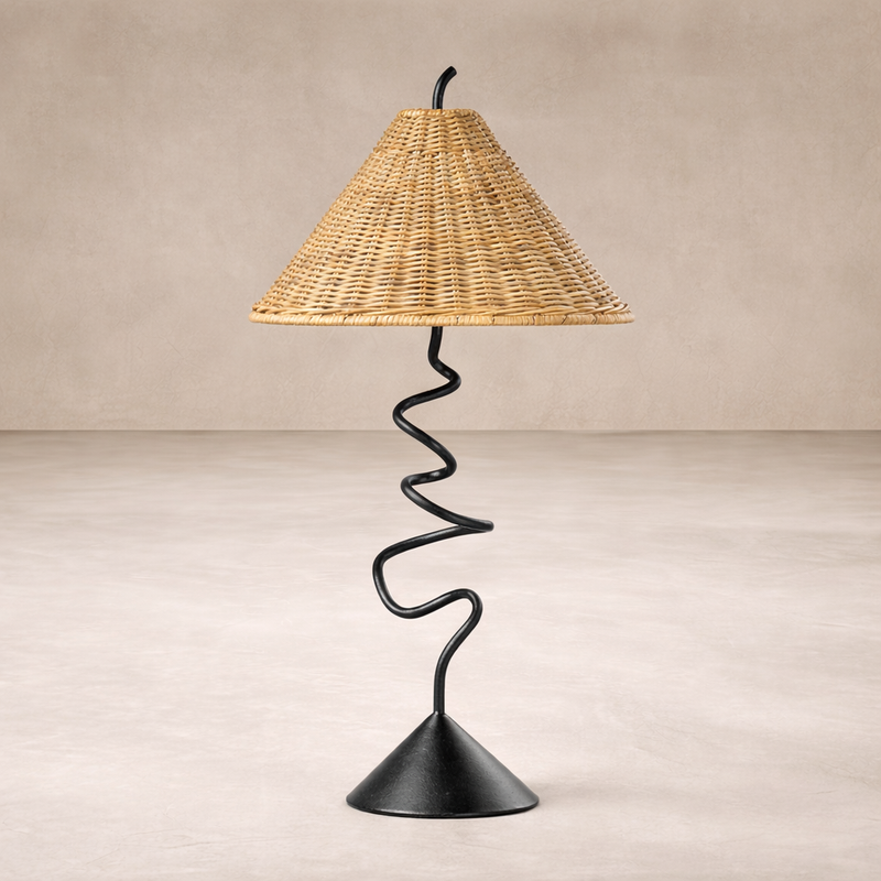 Side angle of the Anya Lamp featuring a woven conical shade and a sleek, twisted black metal base.
