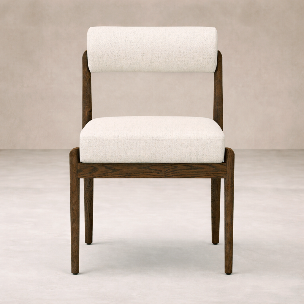 Front view of the Calista Dining Chair featuring a sleek wood frame and soft upholstered seat.