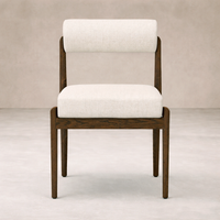 Front view of the Calista Dining Chair featuring a sleek wood frame and soft upholstered seat.