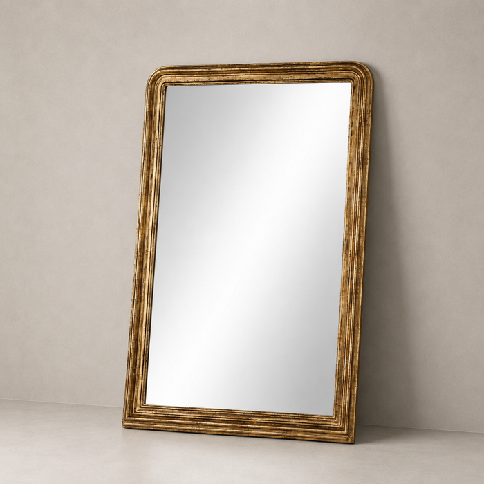 Antiqued Gold Leaf Antonia Floor Mirror with ornate textured frame detail.