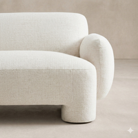 Close-up of the Elba Accent Chair showcasing its soft, textured fabric and rounded arm design.