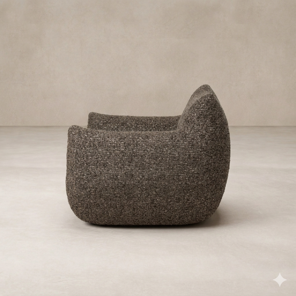 Side angle of the Ciel Swivel Chair showcasing its rounded, textured design in a neutral tone.