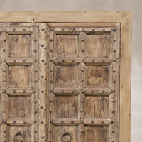 Detail of the Hanoi Vintage Haveli Door Cabinet showcasing its rustic wood finish and decorative hardware.