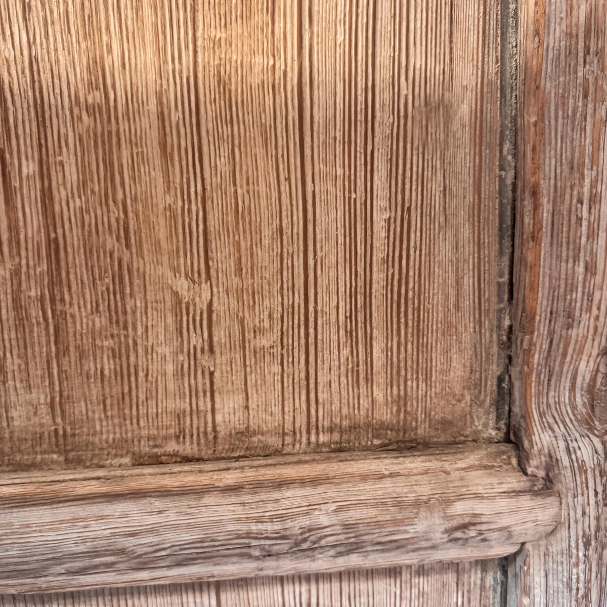 Close-up of the carved elm vintage lattice doors, showcasing intricate wood grain and rustic charm.