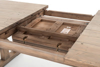 Detail of the Positano Extension Dining Table showcasing its hidden leaf storage and sturdy wooden construction.