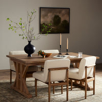 Positano Extension Dining Table in a cozy setting, featuring a natural wood finish and sturdy X-base design.