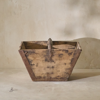 Front view of a vintage 19th-century rice bucket, showcasing its rustic wooden construction and metal accents.