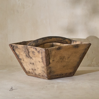 Side angle of a vintage 19th-century rice bucket, showcasing its rustic wooden construction and sturdy handle.