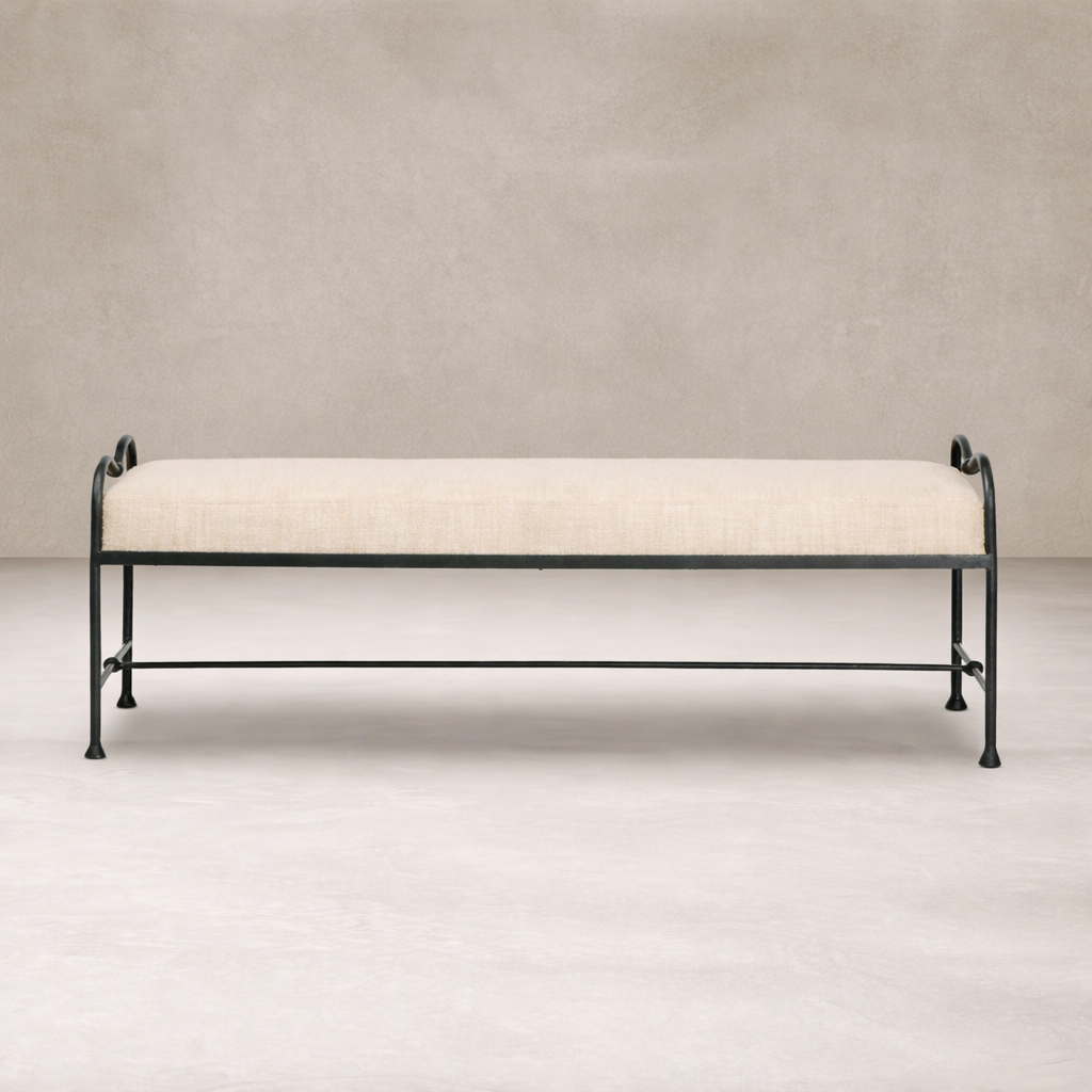 Front view of the Rune Accent Bench featuring a soft linen cushion and elegant black metal frame.