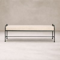 Front view of the Rune Accent Bench featuring a soft linen cushion and elegant black metal frame.