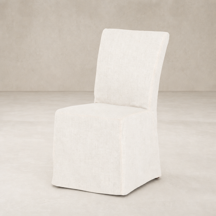 Sierra Slipcovered Dining Chair in soft, textured fabric with a minimalistic design.