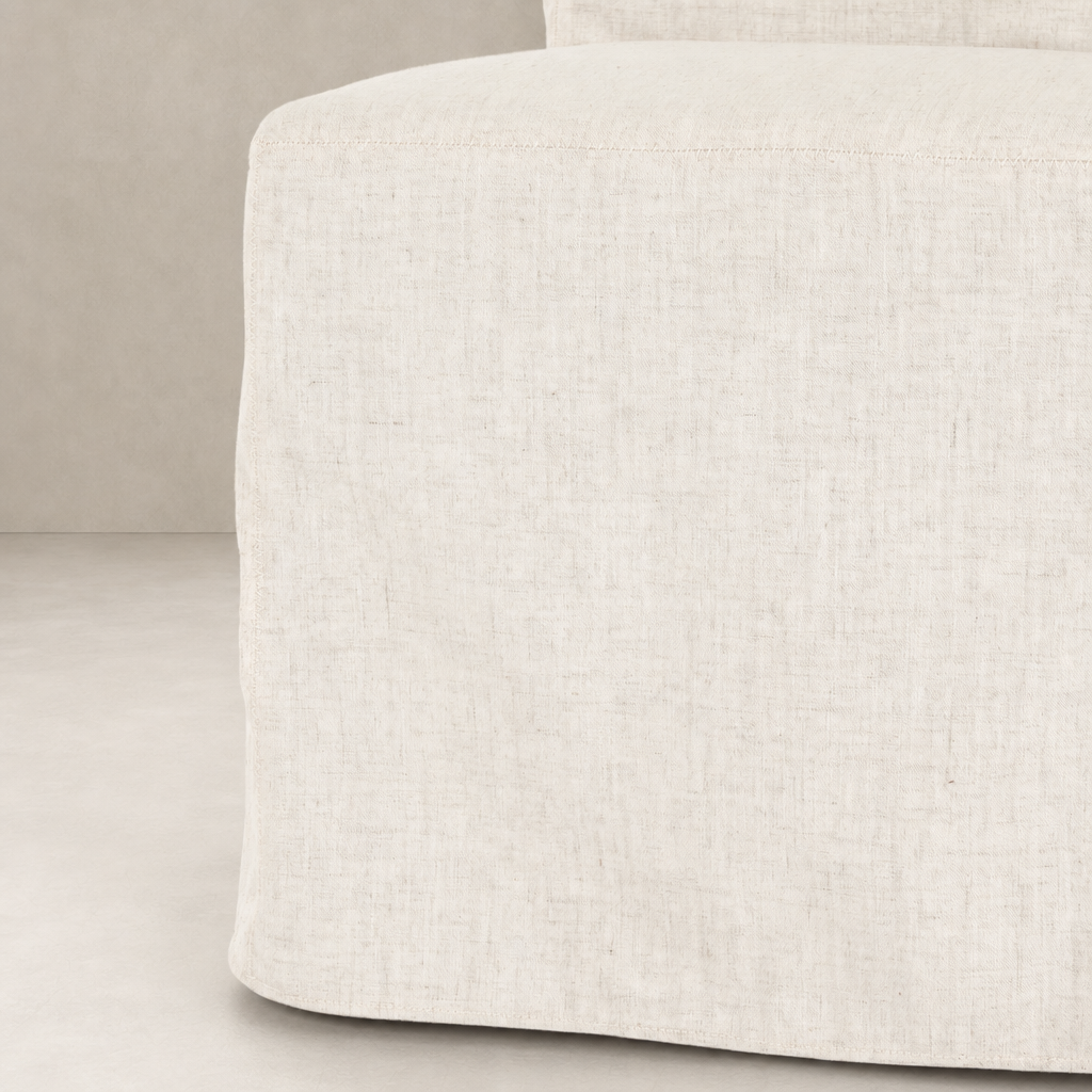 Sierra Slipcovered Dining Chair in soft, textured fabric showcasing a modern, minimalist design.