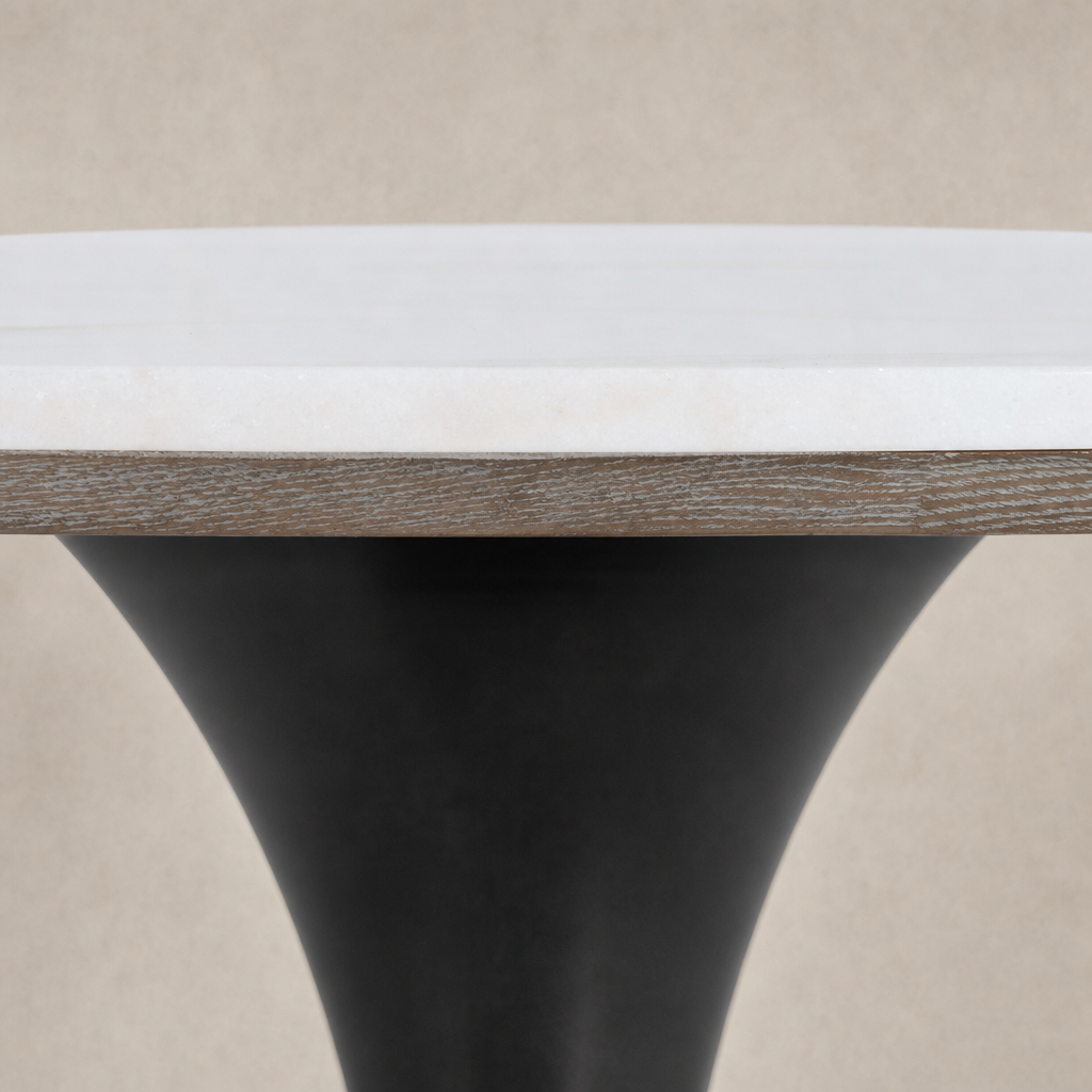 Modena Dining Table featuring a sleek white marble top with a tapered black base.