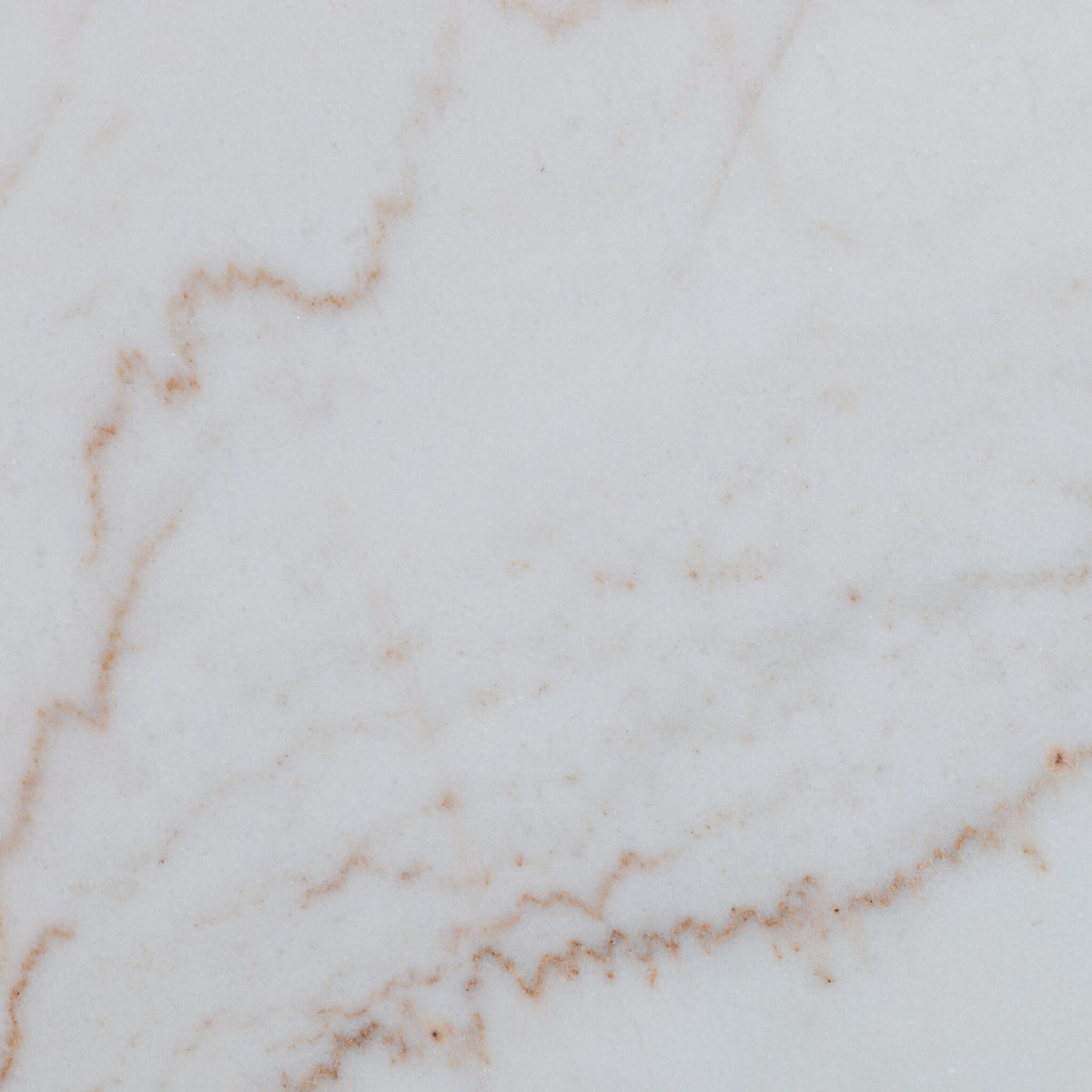 Detailed close-up of the white marble finish of the Modena Dining Table.