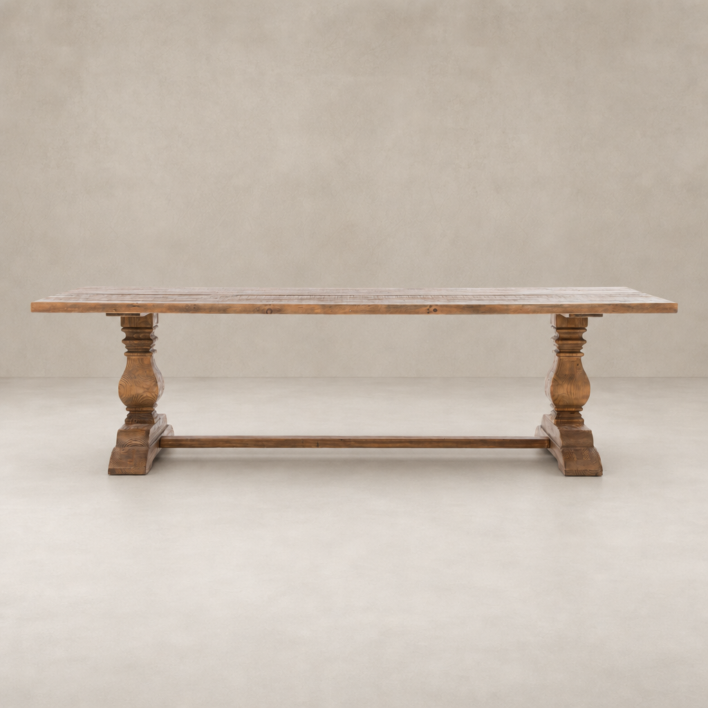 Castelli Dining Table in waxed bleached reclaimed pine with ornate turned legs.