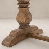 Detailed wood grain and texture of the Castelli Dining Table's waxed bleached reclaimed pine base.