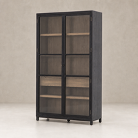 Kyra Cabinet with sleek black finish and glass doors, featuring wooden shelves inside.