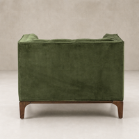 Murano Chair in sapphire olive featuring a plush fabric and wooden legs.