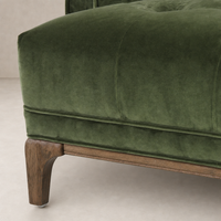 Sapphire olive Murano Chair featuring plush upholstery and elegant wooden legs.