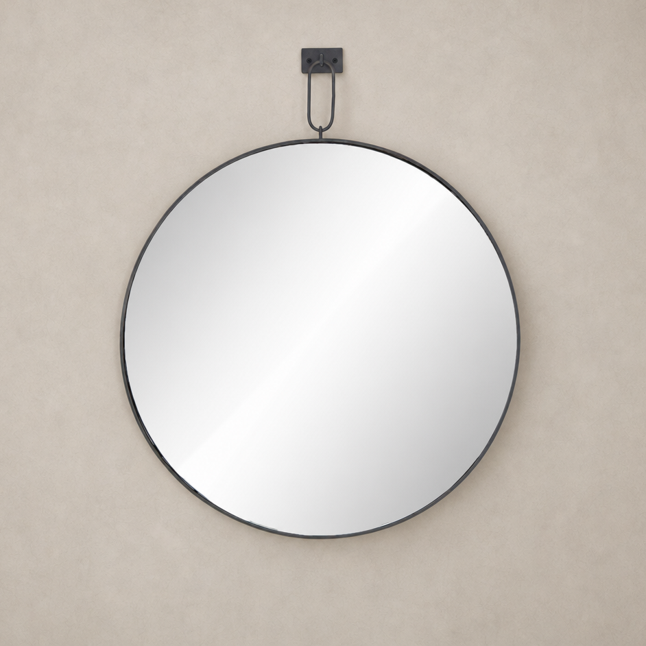 Circular Vida Mirror with a sleek black metal frame, perfect for modern decor.