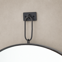 Vida Mirror featuring a sleek black metal hanging loop and rounded edge design.