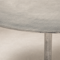 Kensington Bistro Table in raw antique nickel featuring a textured round top.