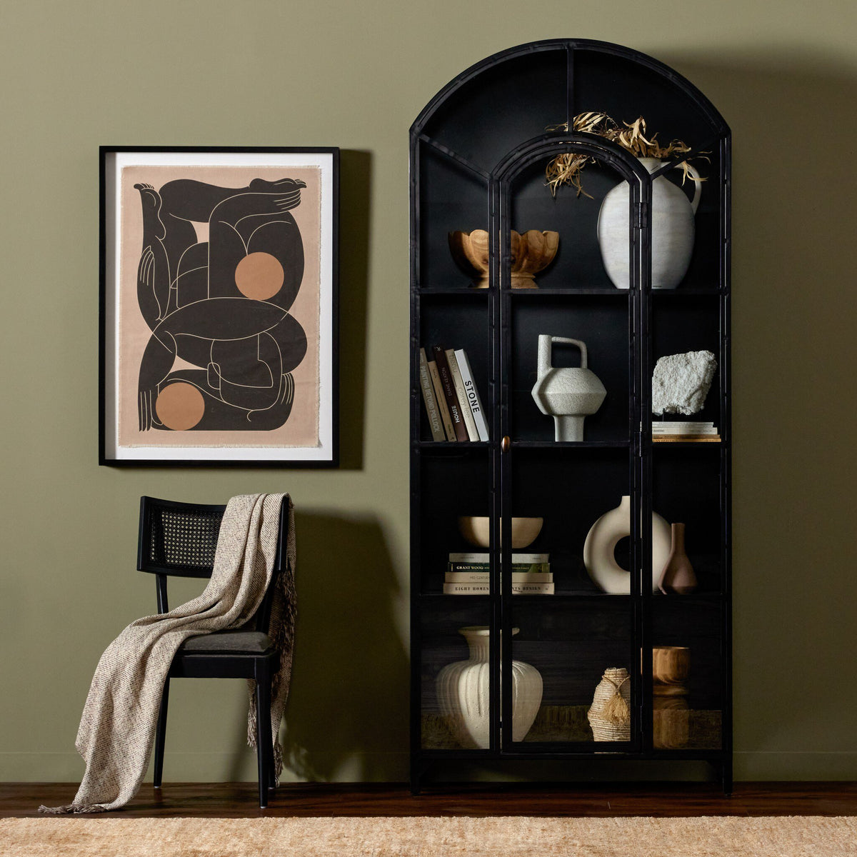 Stylish Kona Cabinet in black showcasing geometric shelves with decorative items.